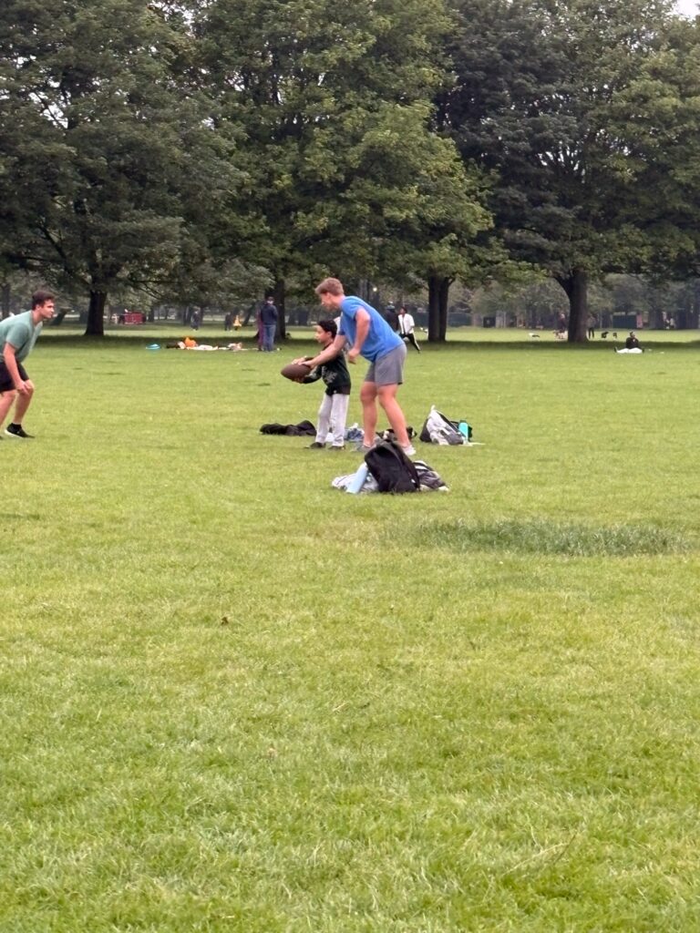Students playing American football while in the UK.