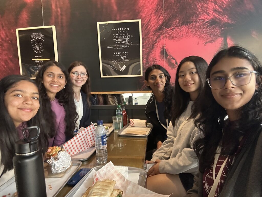 A group of students showing off their lunch.