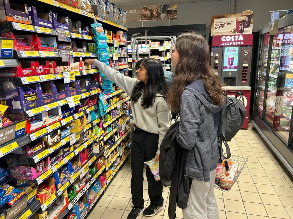 Students picking candy at a convenient store.
